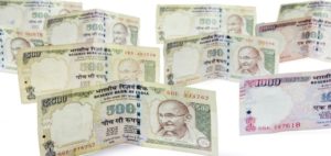 How can NRIs convert 500 and 1000 notes in UK